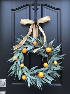 Citrus Bay Leaf Wreath - TwoInspireYou Wreath With Oranges, Popular Wreaths, Eucalyptus Centerpieces, Modern Natural Decor, Bay Leaf Wreath, Dried Hydrangea Wreath, Citrus Christmas, Citrus Wreath, Fabric Ceiling