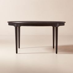 a black table sitting on top of a white floor