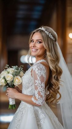 a woman in a wedding dress holding a bouquet of flowers and smiling at the camera