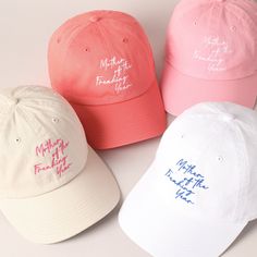 "😘\"Mother of the Freaking Year\" embroidered on a baseball cap is a bold statement piece!  💕 fun and humorous !! An embroidered baseball cap with \"Mother of the Freaking Year\" would make a hilarious and memorable Mother's Day gift! It's a light-hearted way to show appreciation for all the hard work and love that moms put into their families every day. Plus, it's a practical gift that she can wear proudly whenever she wants to add a bit of fun to her outfit. It's sure to bring a smile to her Baseball Cap Women, Casual Curved Bill Hat For Mother's Day, Mother's Day Gift Hats With Letter Print, Casual Curved Brim Baseball Cap For Mother's Day, White Curved Bill Baseball Cap As Gift, White Baseball Cap As A Spring Gift, White Baseball Cap As Spring Gift, Mother's Day Curved Brim Hat With Letter Print, Cute Baseball Cap With Embroidered Logo