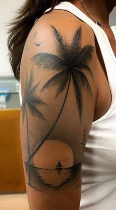 a woman with a palm tree tattoo on her arm