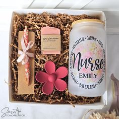 an open box containing a candle, flower and some other items for a nurse's appreciation