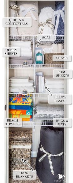 an organized closet with baskets, towels and other items labeled in white letters on the bottom shelf