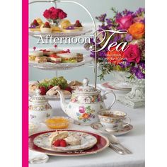 the cover of afternoon tea, featuring plates and cups on a table with flowers in the background