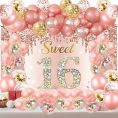 a sweet sixteen birthday backdrop with balloons and streamers in pink, gold and white