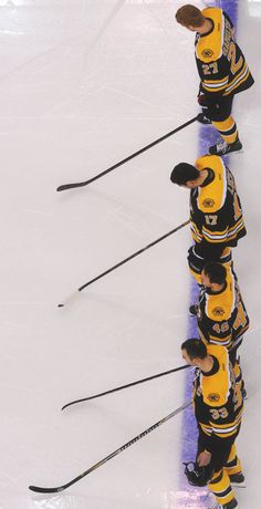 the hockey players are lined up on the ice