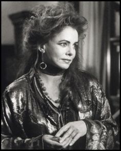 black and white photograph of a woman sitting at a table