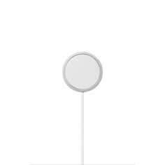 a round mirror on a white stand against a white background