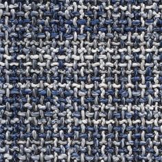 an up close shot of a blue and white tweed textured material with small squares