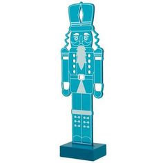 a paper cut out of a blue nutcracker standing upright on a white background