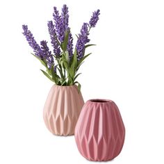 two pink vases with lavender flowers in them