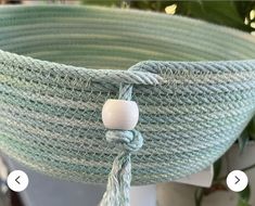 a close up of a green basket hanging from a ceiling