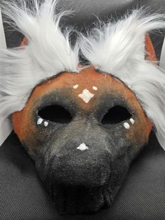 This handmade Maned Wolf mask is perfect for any furry/therian costume. The mask features a Maned Wolf-inspired design and is made of high-quality felt material. It's a great accessory for anyone who likes to dress up! The unlined Maned Wolf mask makes it a unique addition to any collection. Perfect for costumes, reenactments, and theater productions, this mask is sure to impress. Add it to your collection today and let your inner Wolf shine! This mask may have marks from handmade making, including but not limited to paint in places it seems like it shouldn't be, somewhat messy hot glue, loose hot glue strings, and small fabric shedding from the painting process. This mask is made unlined for the buyer to line themselves, lining material is NOT provided. There is no elastic on this mask du Maned Wolf, Therian Mask, Wolf Mask, Animal Masks, Felt Material, Painting Process, Mask Making, Hot Glue, Costume Accessories