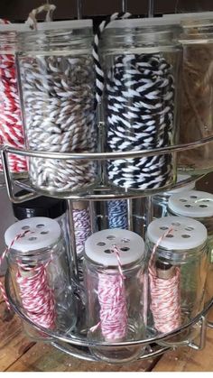 there are many spools of thread in the jar