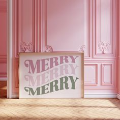 a pink room with a merry sign on the floor