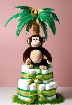 a monkey sitting on top of a pile of diapers with a palm tree in the background