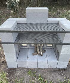 a cement fire place with logs sticking out of it