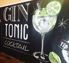 a chalkboard sign advertising gin tonic cocktail