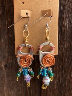 the earrings are made with wire and glass beads