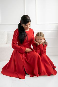 "Red matching dresses, the unforgetable dresses that you will always remember!  Where them as your mommy and me Christmas dresses, or for other special occasions you attend to, one thing is for sure, you'll have a matching dress with your daughter, so everyone eyes will look only at you!  ❤ MADE ESPECIALLY FOR YOU The dresses are made from a soft fabric, with a zipper on the back.  The mother dress has a midi skirt with decorative buttons. The daughter dress has a full circle skirt for more volume and twirling. The dresses can be made on almost any colour, contact me for details. ❤ MATCHING SETS The listing is for a matching set with your daughter, so you will receive two complete outfits. ❤ SIZE Please check chart size here before placing your order or contact me for any details. ❤ DETAIL Red Dresses Long Sleeve, Red Dresses Long, Daughter Dress, Matching Clothing, Mother Dress, Red Dress Long, Red Long Sleeve Dress, Christmas Dresses, Family Photo Outfits