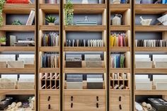 the shelves are filled with many different types of papers and folders, including books