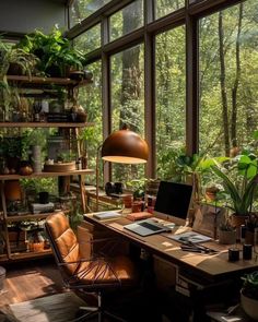 a home office with lots of plants in the window