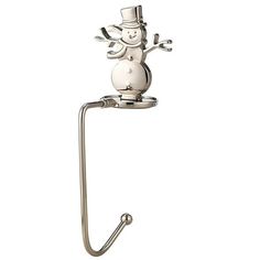 a white toilet paper holder with a snowman on it's back and arms