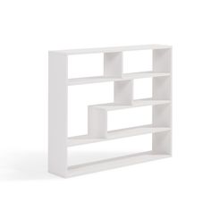 a white book shelf sitting on top of a floor