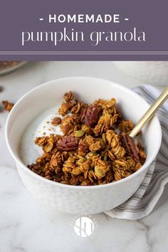 homemade pumpkin granola in a white bowl on a marble countertop with text overlay