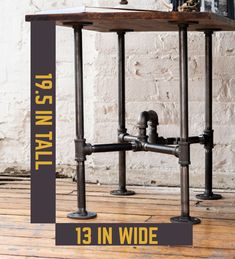 the table is made out of metal pipes and has a clock on it with an inscription that reads, 13 in wide