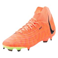 a pair of orange and black soccer cleats