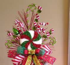 a christmas decoration with candy canes and candies