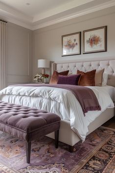 a large bed sitting in the middle of a bedroom