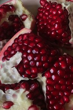 the pomegranate is cut in half and ready to be eaten