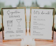 two menus with drinks on them sitting on a table