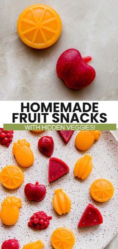 homemade fruit snacks made with hidden veggies on a white platter, including oranges and raspberries