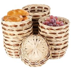 four wicker baskets with bread and grapes in them