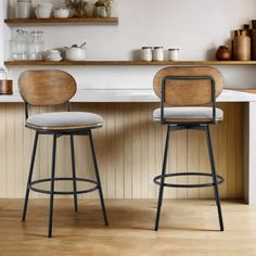 two stools sitting next to each other in a kitchen