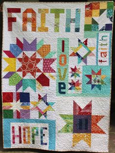 a quilt made to look like it has the words faith love and stars on it