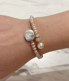 This Moonstone, Pearl & Coin Pearl Memory Wire Bracelet is the perfect way to complete your outfit! This piece of jewelry is made with all-natural stones, and the coil pearl adds some sparkle to your wrist. It's easy to take on-and-off with its memory wire - no clasp necessary! Get ready to shine. Affordable Pearl Crystal Bracelet For Gifts, Jewelry Techniques Pearl, Upcycle Pearl Jewelry, Handmade Jewelry Bracelets Wire, Memory Wire Necklaces Ideas, Beaded Wire Bracelet Tutorial, Adjustable Pearl Bracelets With Gemstone Beads, Adjustable Hand-strung Pearl White Pearl Bracelet, Adjustable Hand-strung White Pearl Bracelet