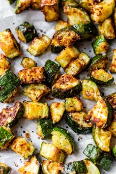 grilled zucchini on parchment paper with seasoning