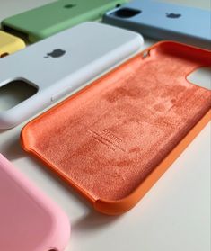 four different colored cases sitting next to each other