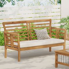 a wooden bench sitting on top of a patio next to a table with a pillow