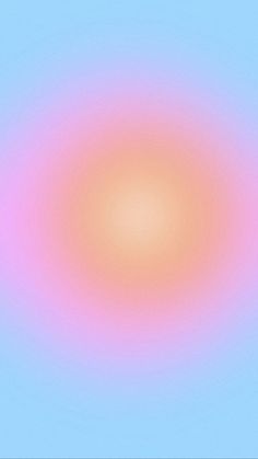 an orange and pink circle on a blue sky with some clouds in the back ground