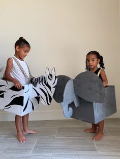 This listing is for two (2) animals a Zebra and Elephant. Turn a cardboard box into your favorite safari animal with this downloadable instructional. This DIY PDF is customizable according to the materials and supplies that you use. The eco-friendly tutorial provides a flexible supply list and encourages recycling, and using items you probably already have at home.    Whether you're looking for a unique halloween costume, or to let your children's imaginations grow while learning about recycling Cardboard Animal Costume, Diy Elephant Costume Kids, Zebra Diy Costume, Elephant Diy Costume, Safari Dress Up Day At School, Diy Safari Costume, Diy Animal Costume For Kids, Safari Costume Diy, Diy Zebra Costume