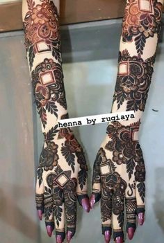 the hands and feet of a woman with henna