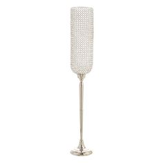 a tall silver candle holder on a white background