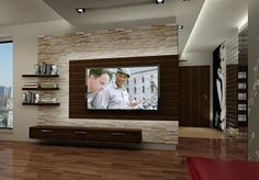 a large flat screen tv mounted to the side of a wall in a living room