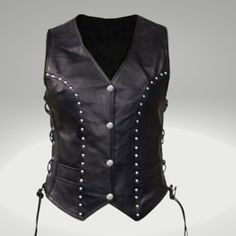 [STYLE & FEATURES]: - A women's black leather vest that has been expertly created and is constructed from top-notch genuine lambskin leather. An iconic silhouette is created with the ideal balance of stylish finishing touches, sturdy stitching, and durable design, which you'll feel proud to wear all day. If you treat this vest properly, it will last you a lifetime because it is made of the softest, highest-quality real leather. A wonderful present for her! For every event, a gorgeously designed Luxury Leather Women's Vest, Black Fitted Biker Vest, Sleeveless Leather Vest For Bikers, Sleeveless Biker Leather Vest, Women’s Motorcycle Vest, Women Leather Vest, Black Leather Vest, Leather Waistcoat, Style Vest