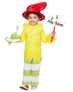 a little boy dressed as the grin costume holding a sign that says i am sam